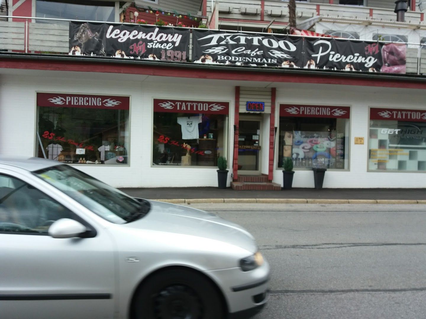 a car is parked in front of a store