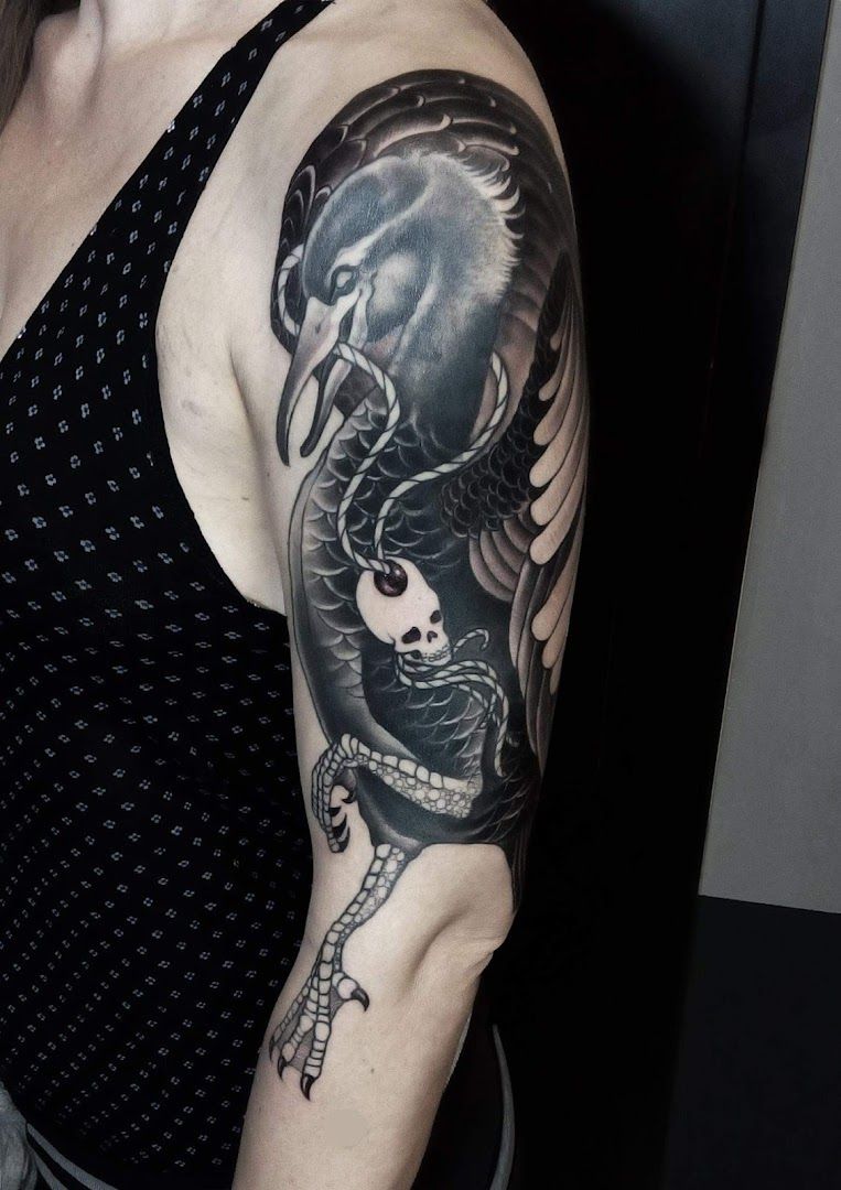 a woman with a black and white narben tattoo on her arm, berlin, germany