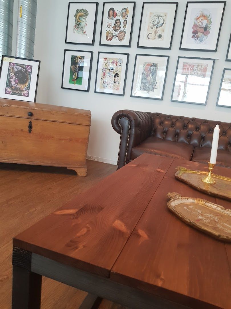 a wooden table with a brown leather chair