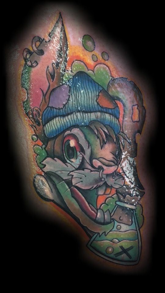 a cover-up tattoo of a cartoon character with a hat and a fish, main-tauber-kreis, germany