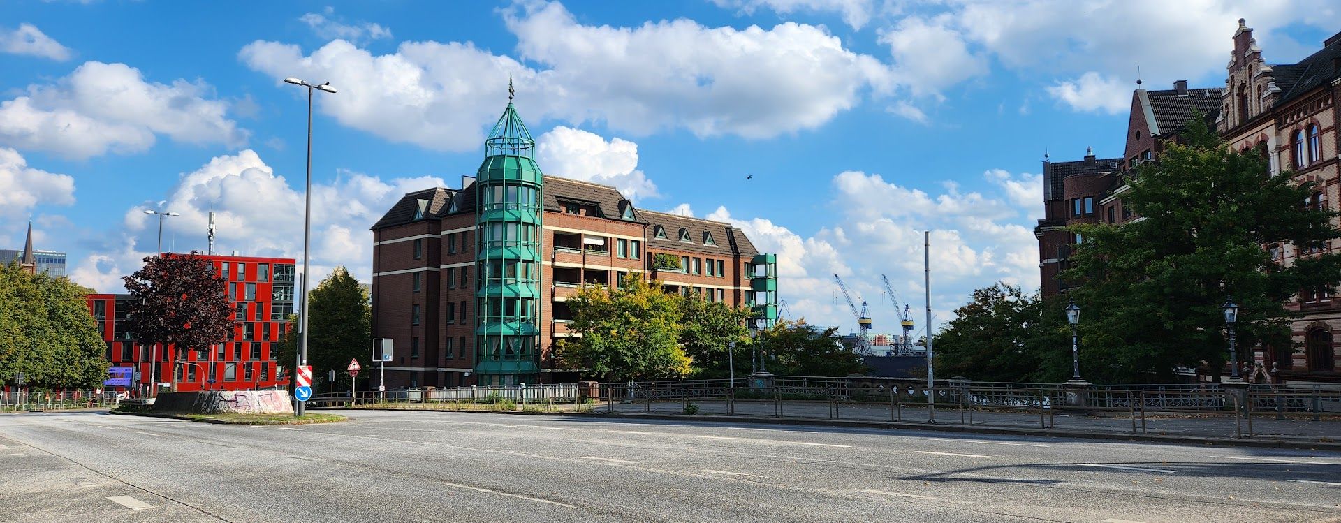 a street with a building and a green dome