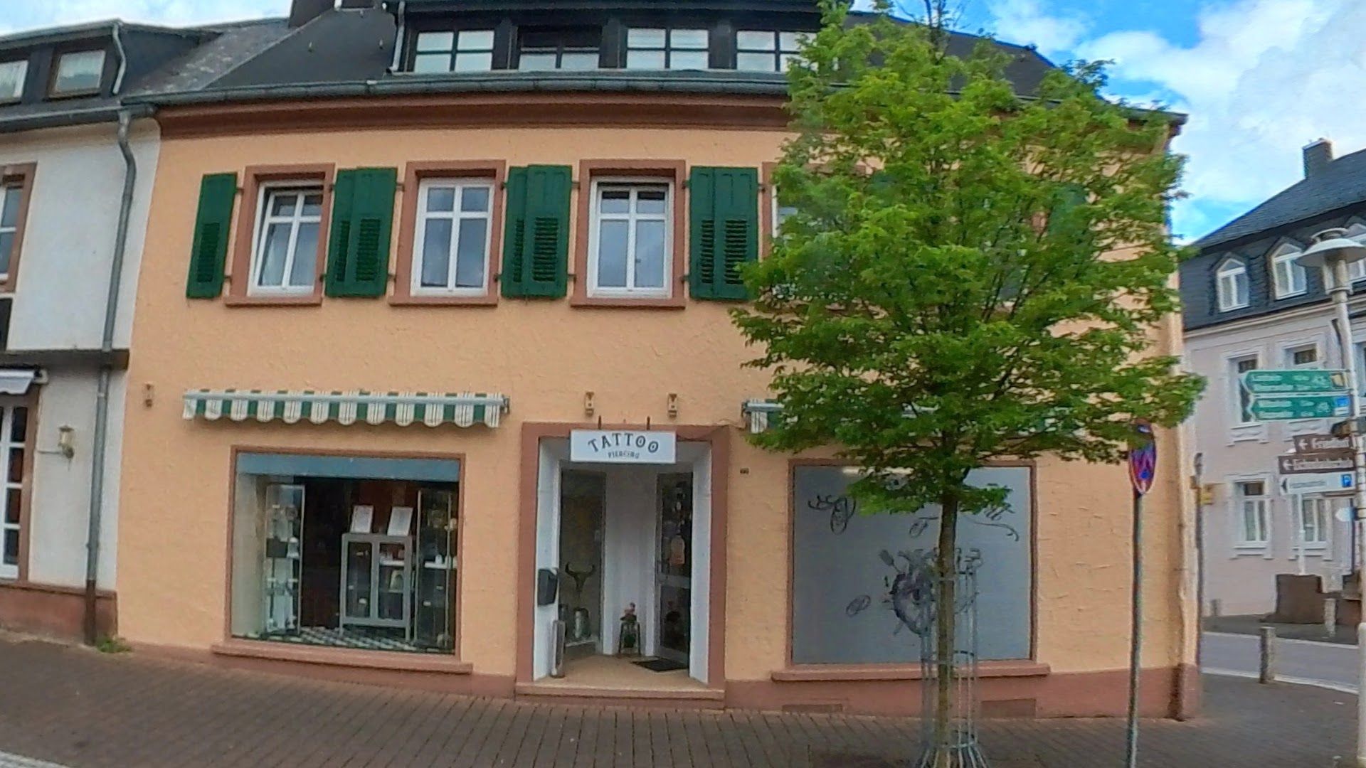a building with green shutters