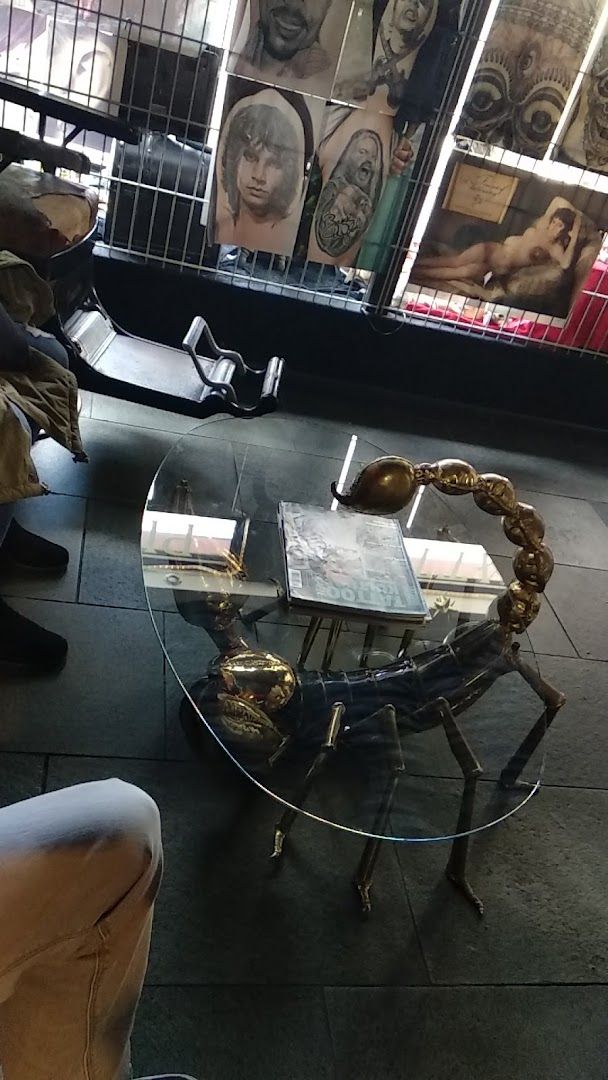 a table with a glass top and a metal base