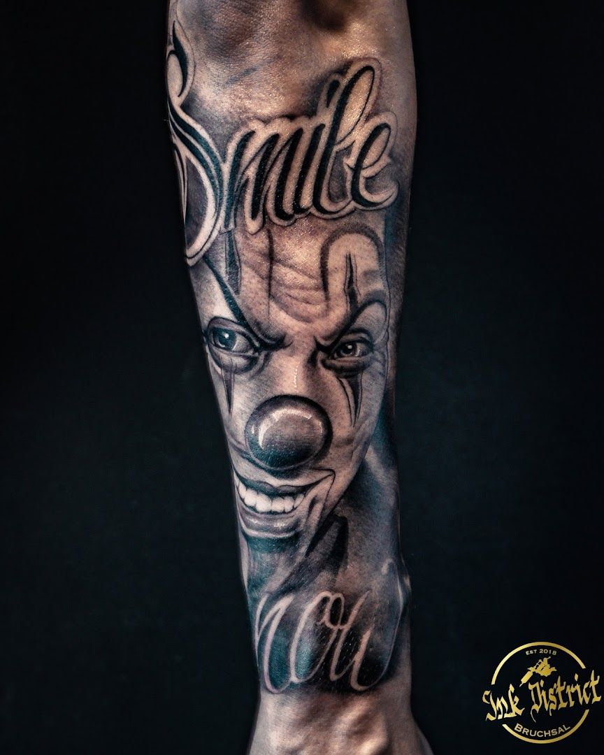 a cover-up tattoo of a clown with the word'smile ', karlsruhe, germany