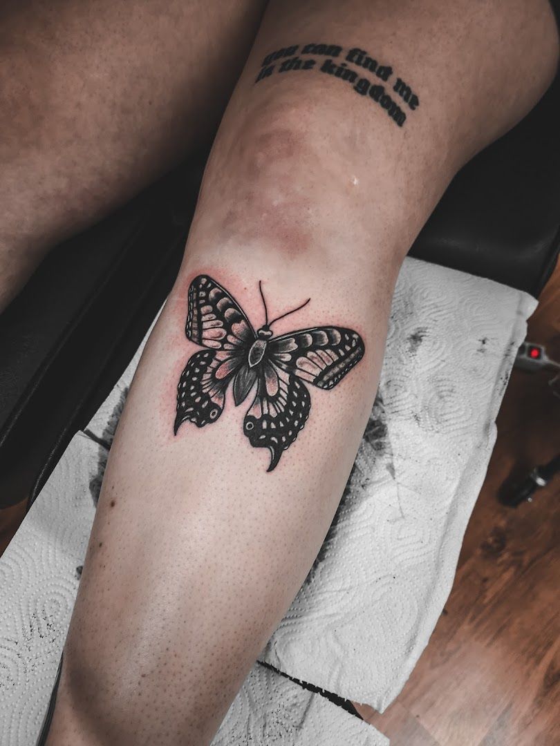 a black and white butterfly narben tattoo on the leg, siegen-wittgenstein, germany