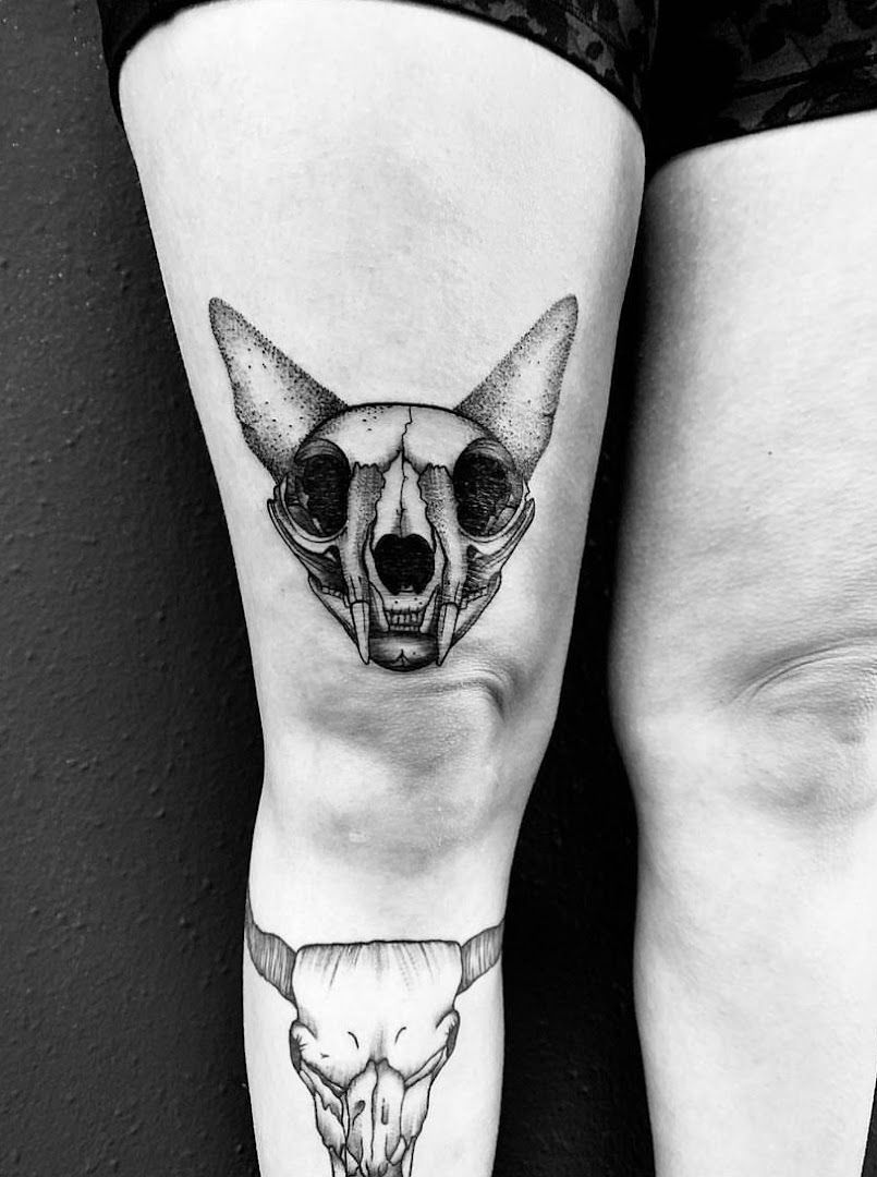 a black and white japanische tattoos in leipzig of a kangaroo with a skull on the leg, saarlouis, germany