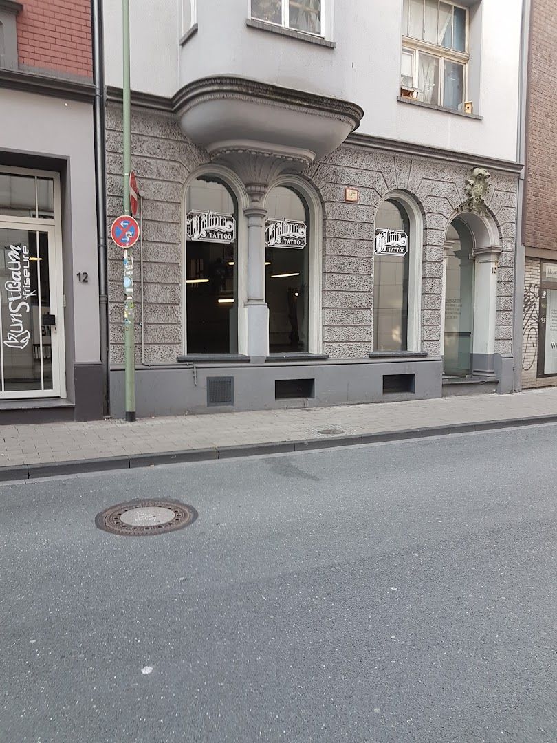 a street with a building and a street sign