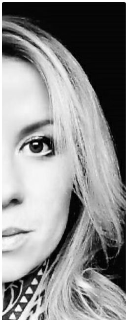 a woman with long blonde hair and a black and white photo