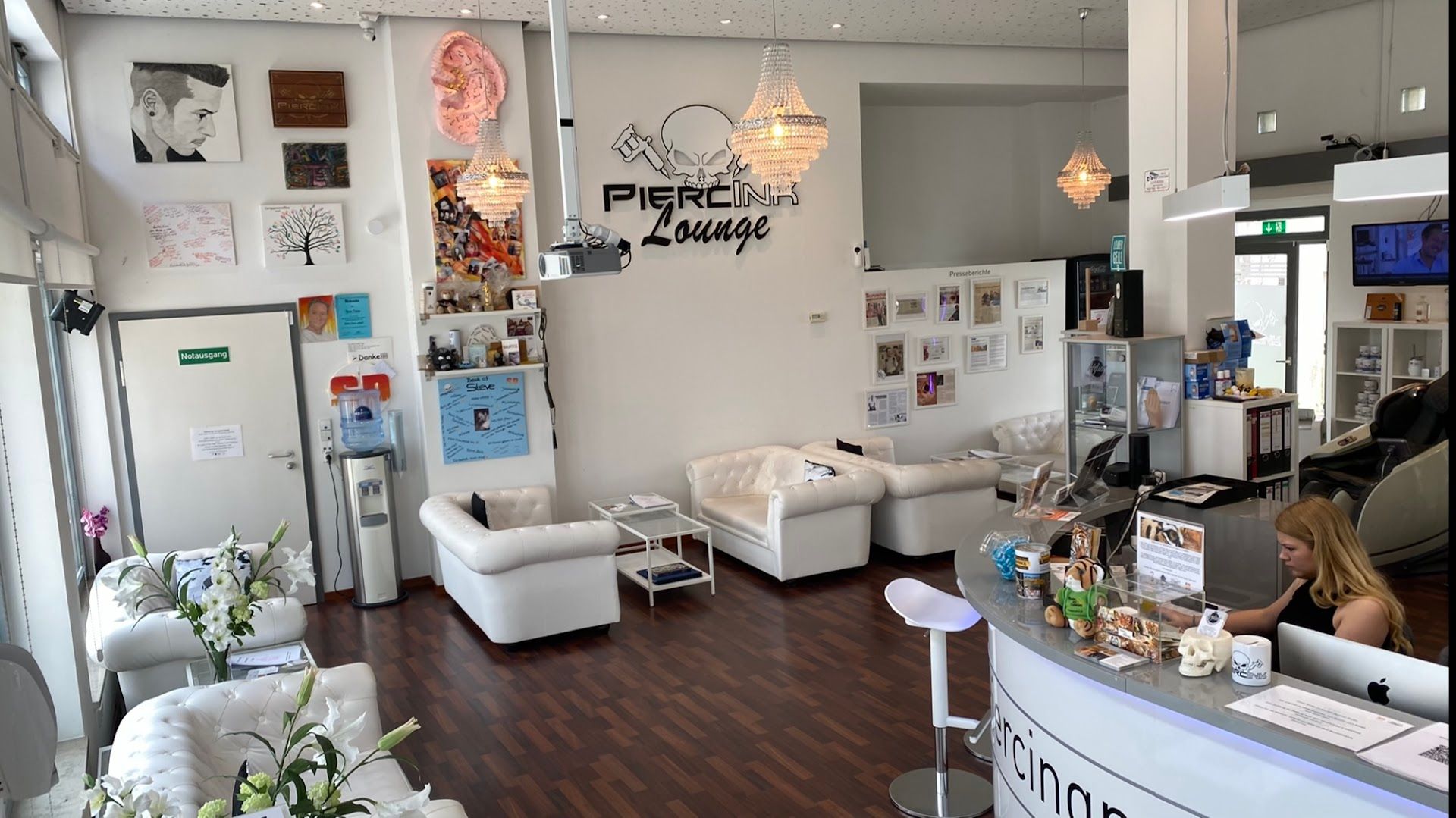 a salon with a lot of white furniture