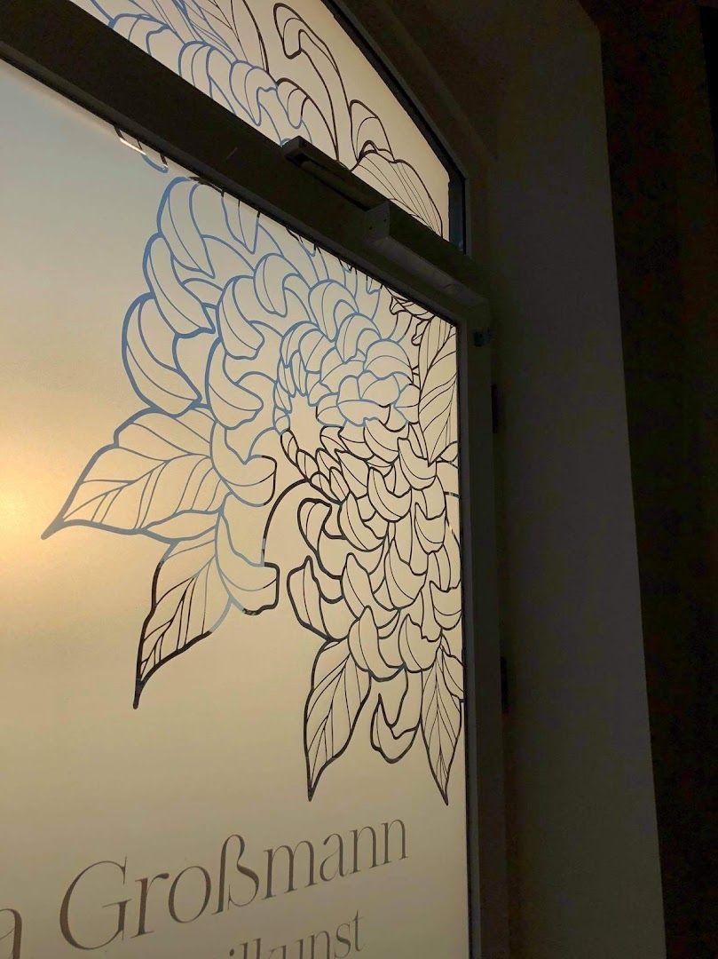 a window with a flower drawn on it