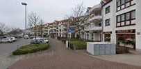 the street in front of the apartment building