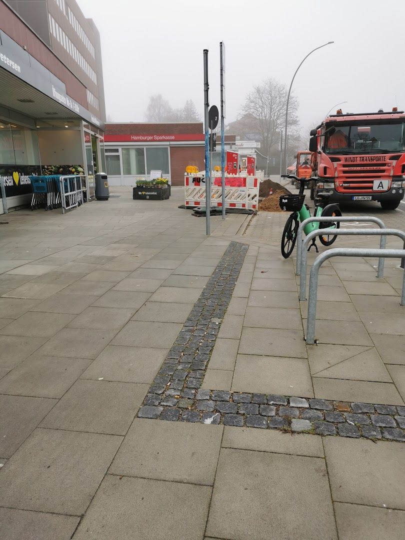 a fire hydra is on the sidewalk in front of a building