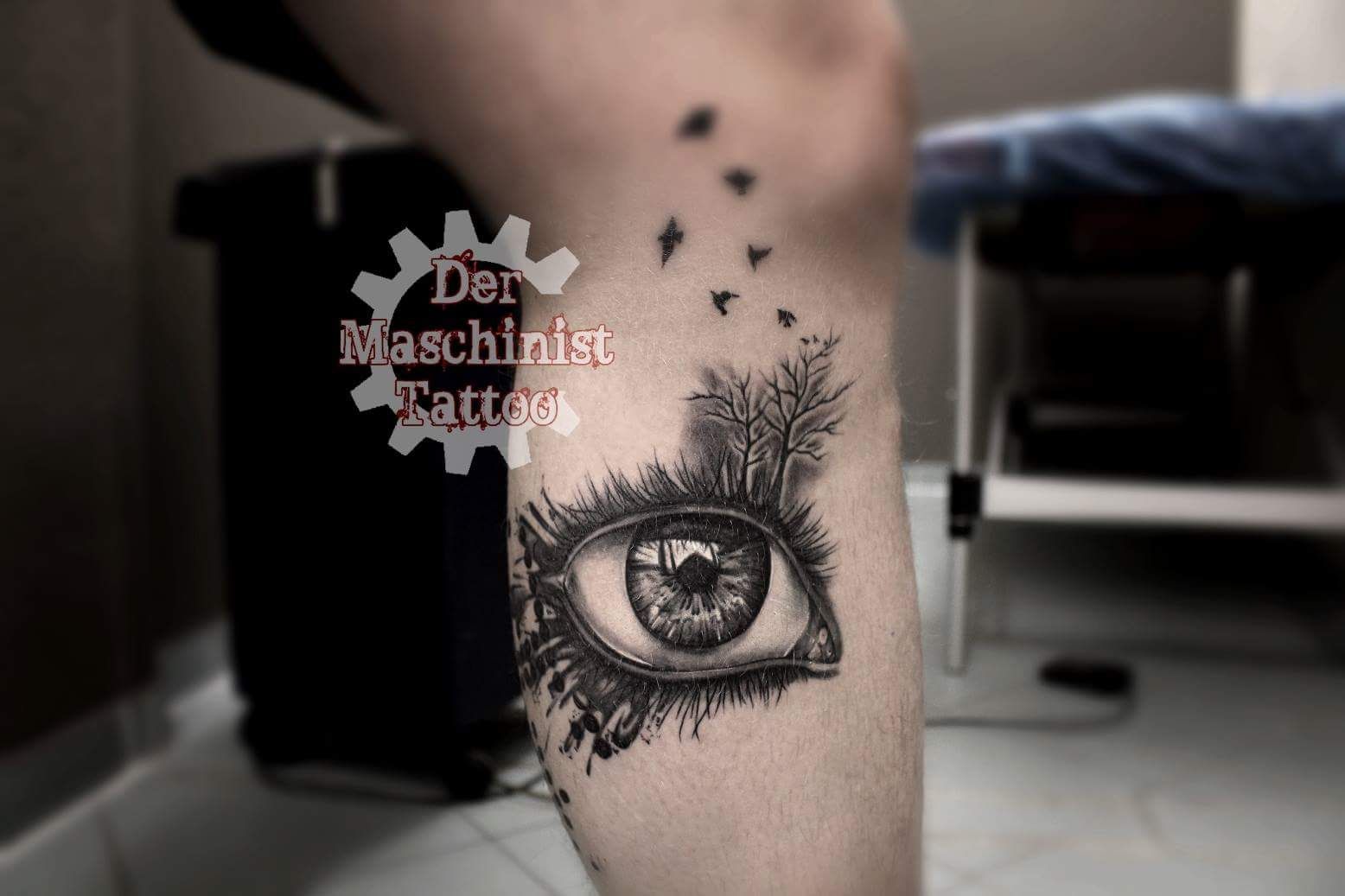 a cover-up tattoo of an eye with a tree and a bird, kreisfreie stadt gera, germany