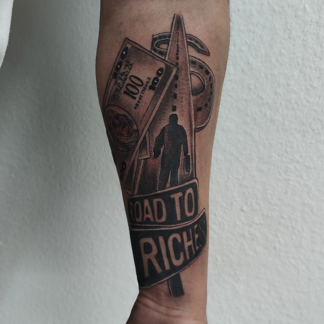 a man's arm with a cover-up tattoo of a man holding a knife and a sign that says, kreisfreie stadt heilbronn, germany