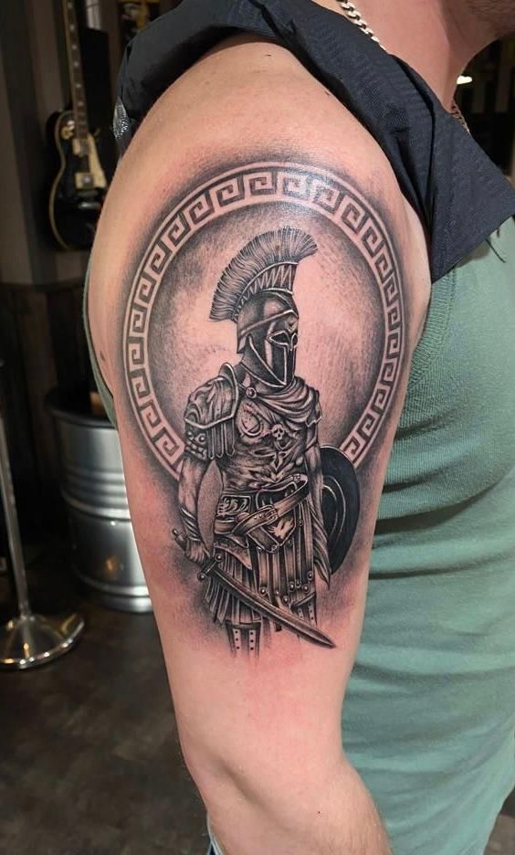 a man with a spartan cover-up tattoo on his arm, soest, germany