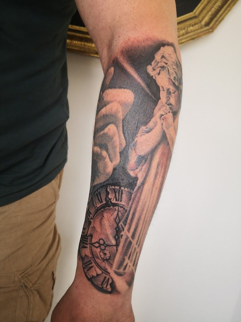 a man with a clock cover-up tattoo on his arm, amberg-sulzbach, germany