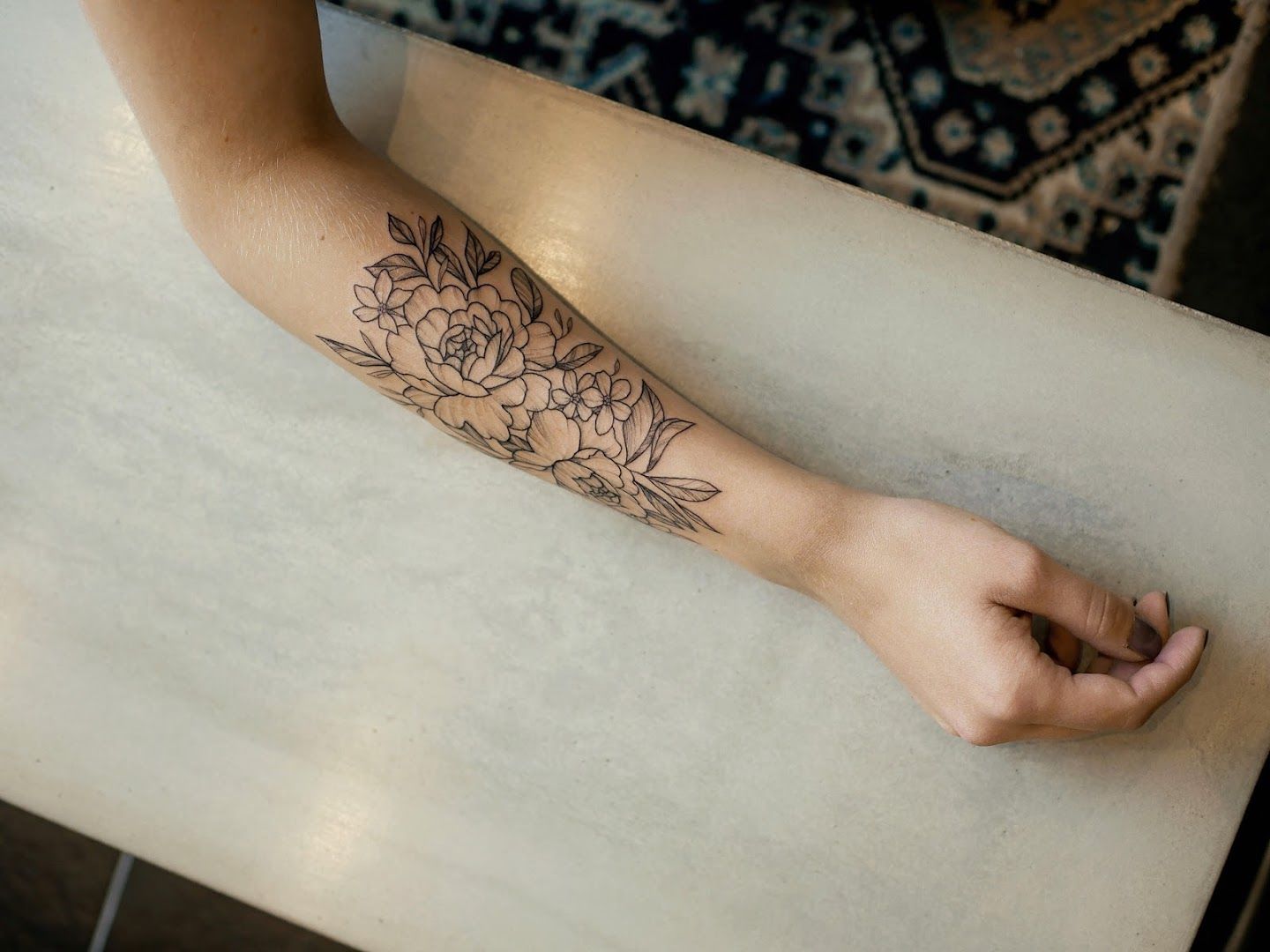 a woman's foot with a narben tattoo of flowers on it, bayreuth, germany