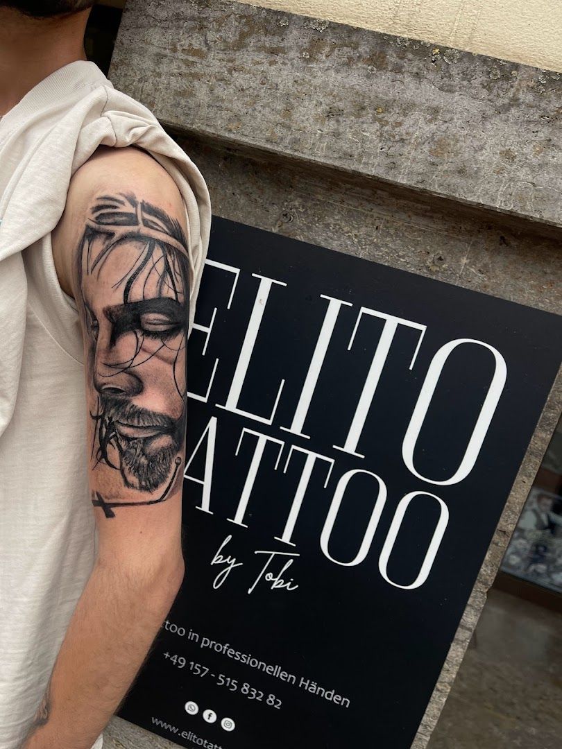 a man with a cover-up tattoo on his arm, aichach-friedberg, germany
