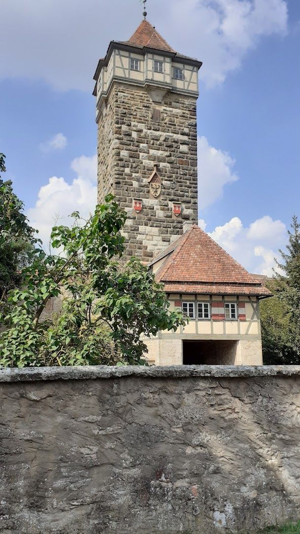 a stone tower with a clock on top