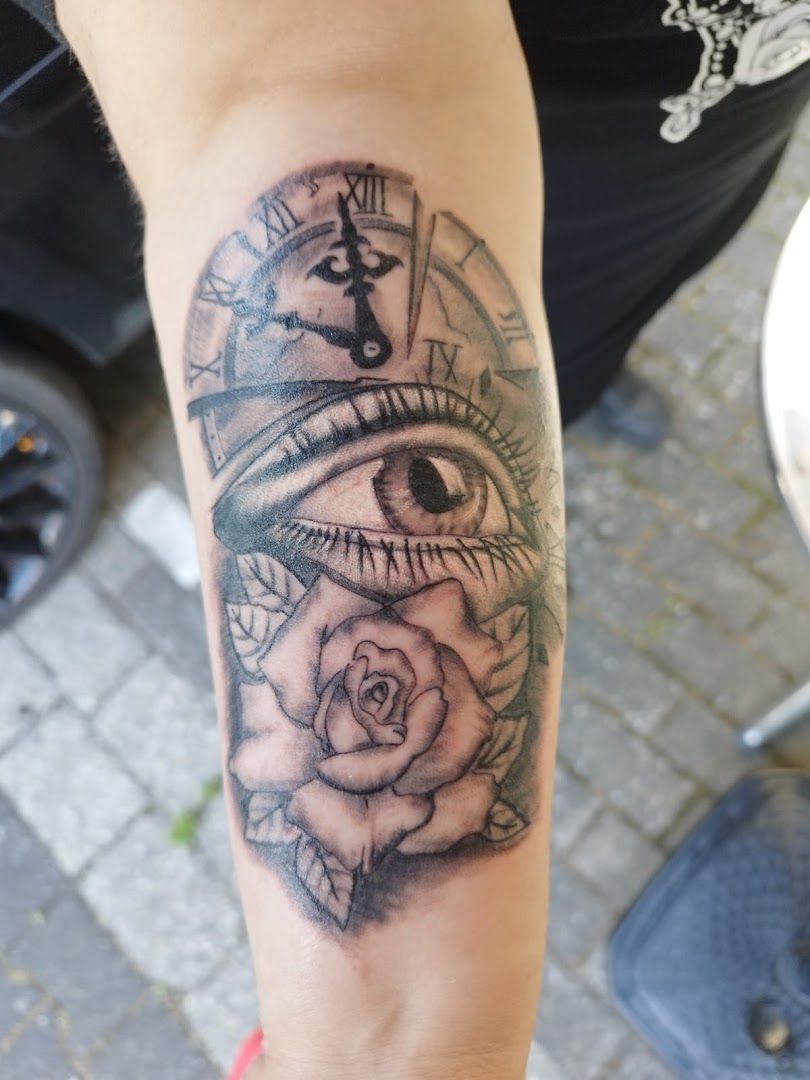 a narben tattoo with a clock and roses on it, soest, germany