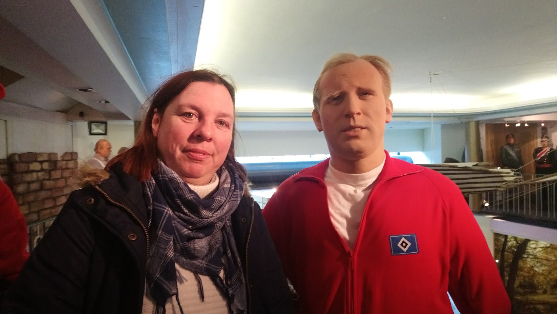 a man and woman standing in a room