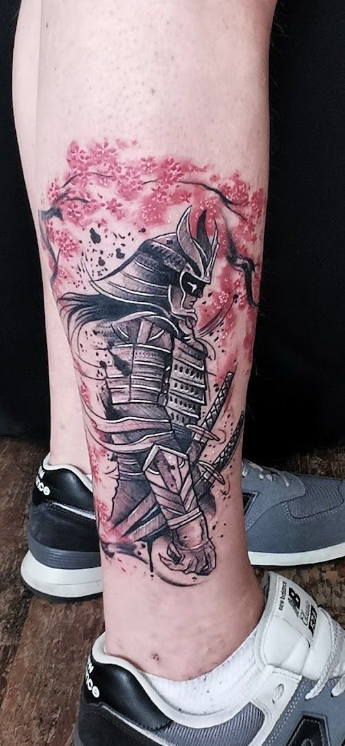 a cover-up tattoo of a man with a samurai on his leg, görlitz, germany