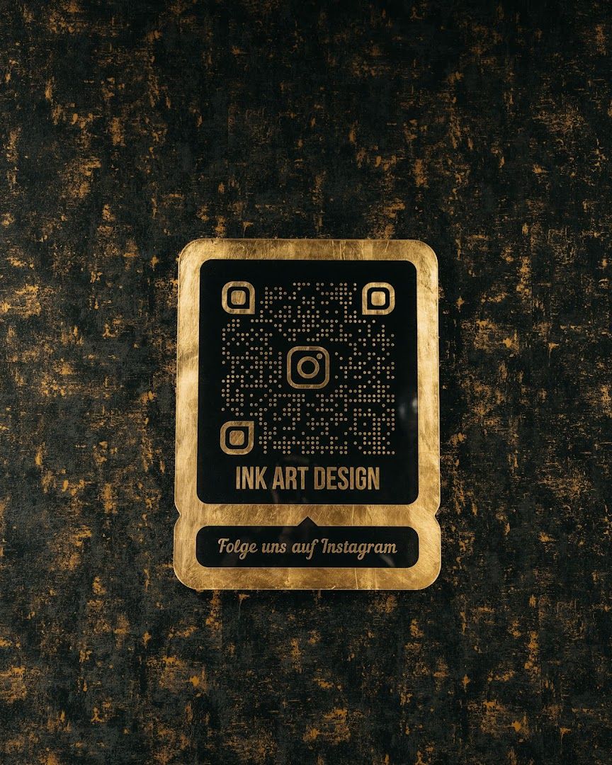 a gold and black logo on a black background