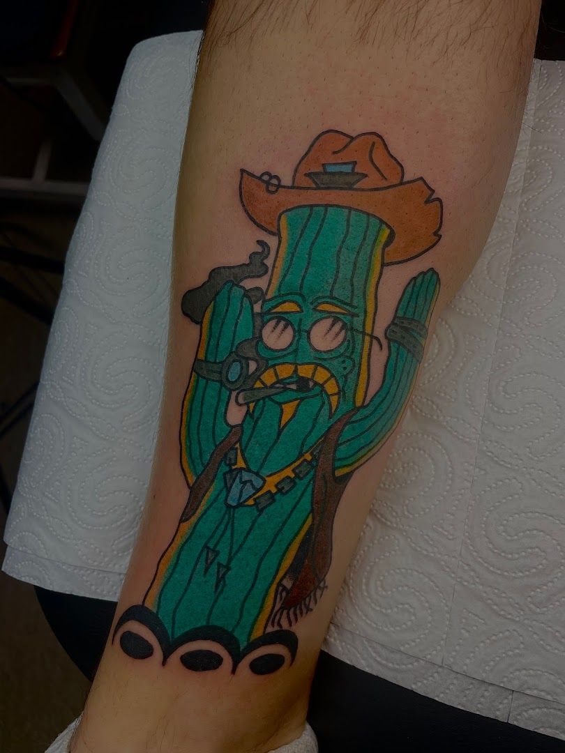 a japanische tattoos in leipzig of a cactus with a cowboy hat and a gun, bayreuth, germany