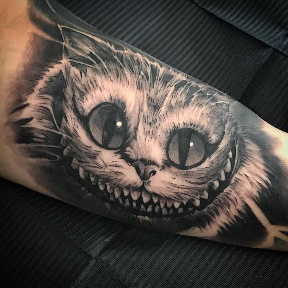 a black and white cat cover-up tattoo on the arm, bochum, germany