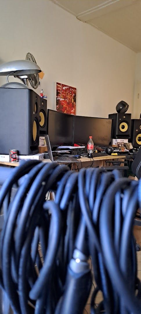 a desk with a bunch of cables on it