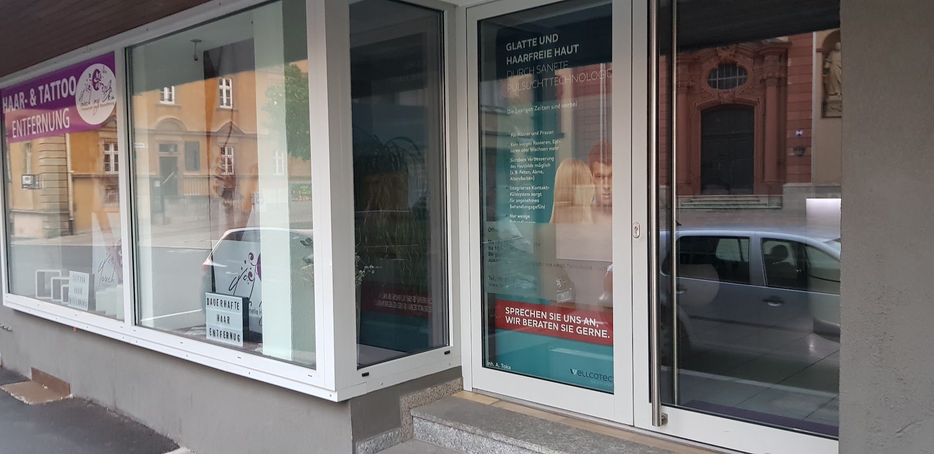 a storefront with a sign that says,'we are open '