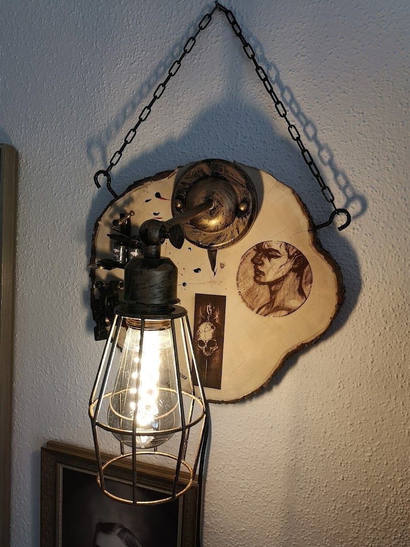 a light fixture hanging on the wall