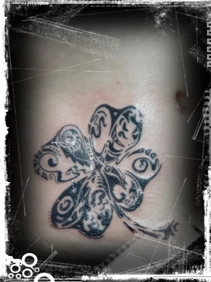 a narben tattoo design of a butterfly on the back of a woman's shoulder, märkischer kreis, germany