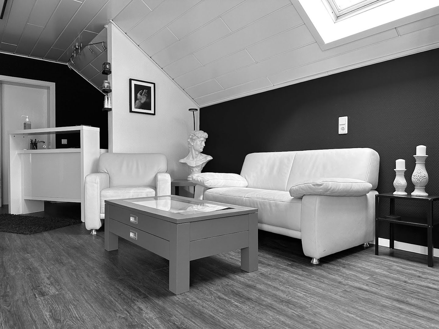 a living room with a white couch and a coffee table