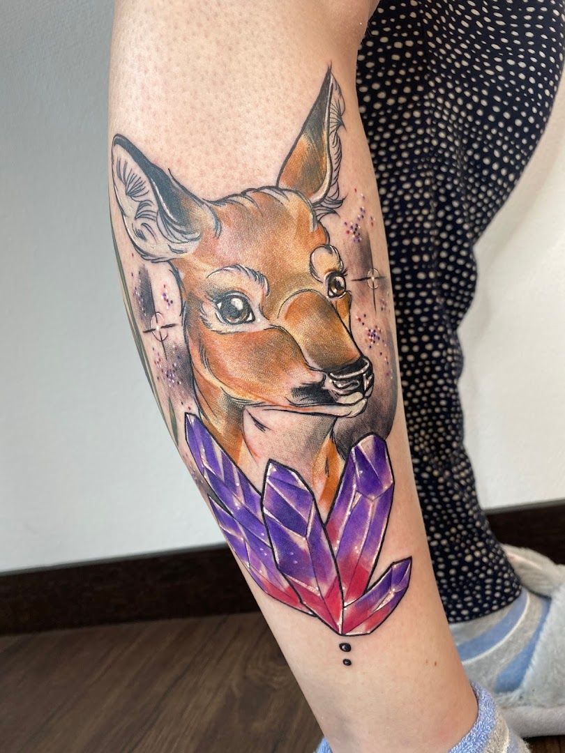 a narben tattoo of a fox with a purple feather, bochum, germany