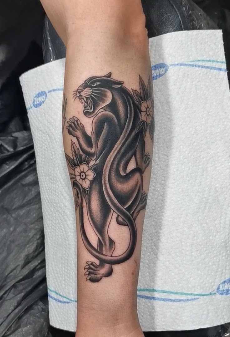 a black and grey cover-up tattoo of a snake on the arm, nürnberg, germany