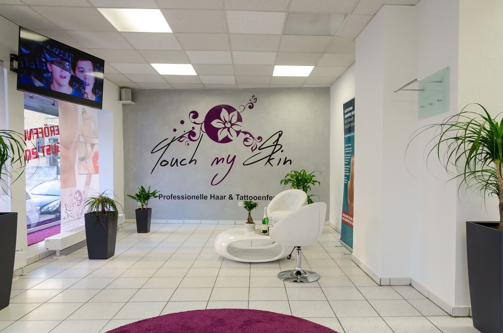 a salon with a purple rug and a purple rug