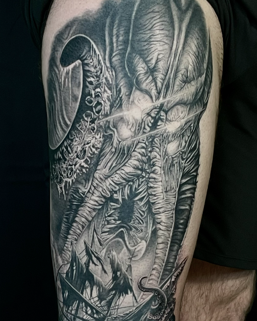a man with a cover-up tattoo on his arm, kreisfreie stadt augsburg, germany