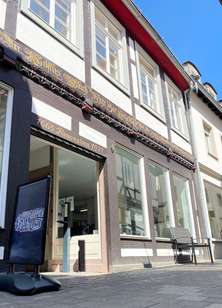 the front of a building with a sign on it