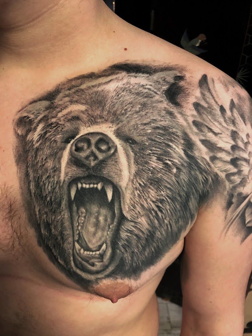 a bear cover-up tattoo on the chest, neu-ulm, germany