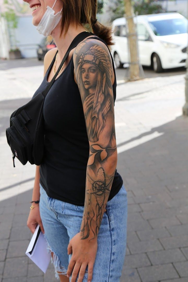 a woman with a japanische tattoos in leipzig on her arm, westerwaldkreis, germany