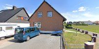 a house with a car parked in front of it