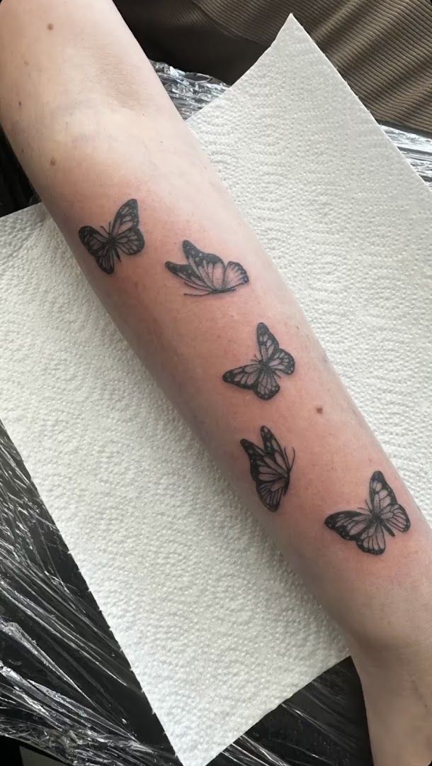 a cover-up tattoo with butterflies on the arm, rhein-neckar-kreis, germany