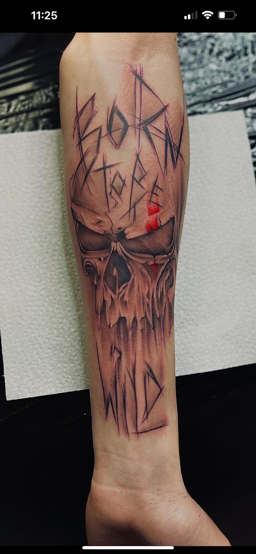 a cover-up tattoo of a skull with a red eye, duisburg, germany