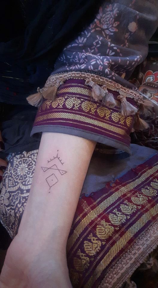 a woman's wrist narben tattoo with a small star on it, unstrut-hainich-kreis, germany