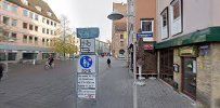 a street with buildings and a sign on it