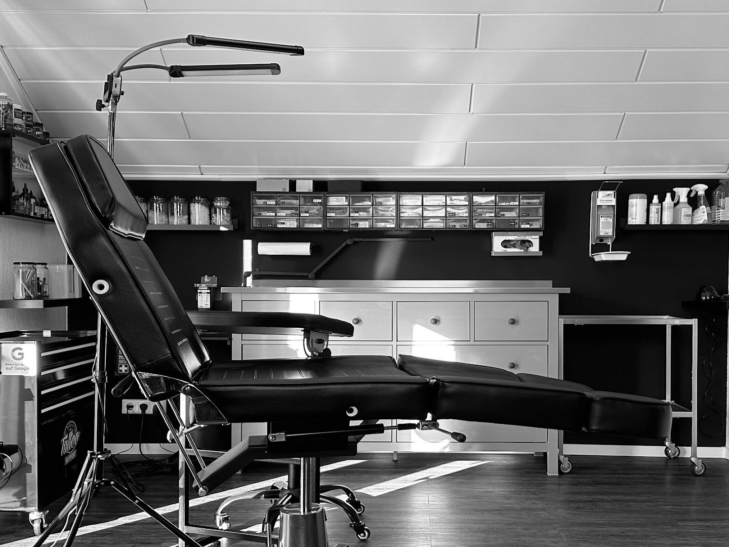 a black and white photo of a barber chair