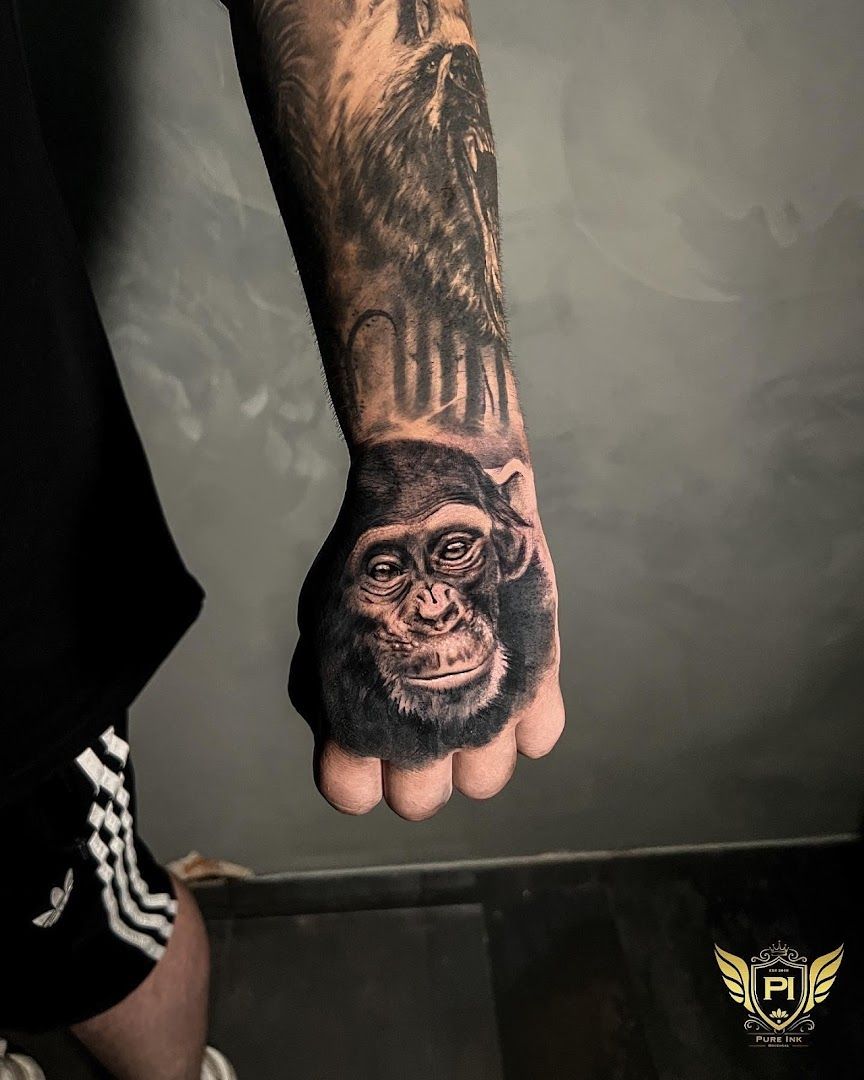 a man's hand with a cover-up tattoo of a gorilla on it, rhein-neckar-kreis, germany