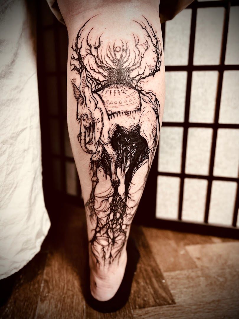 a narben tattoo of a deer skull with a skull on it, bamberg, germany