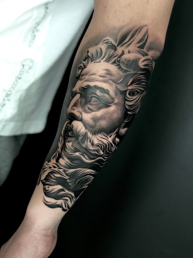 a black and grey cover-up tattoo of a lion on the arm, kreisfreie stadt heilbronn, germany